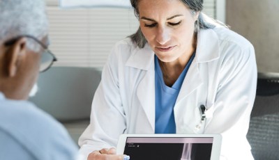 doctor showing patient x-ray